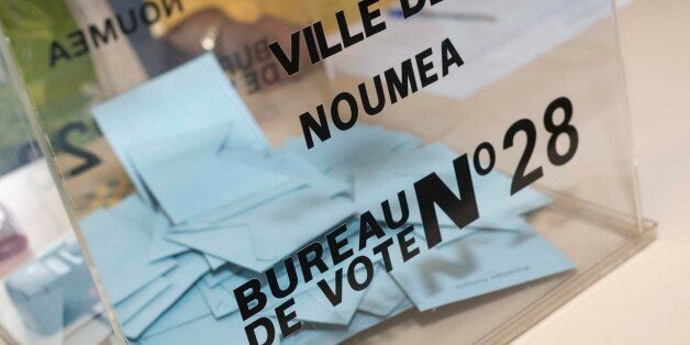 People go to polls in Noumea, New Caledonia island on June 11, 2017 to choose members of the French National Assembly, the country's lower house of parliament, in the first round of country's legislative elections.Prior to the beginning of voting in Metropolitan France, it started in the overseas territories and departments of France. Polling stations for the voters of Guadeloupe, French Guiana, Martinique, St. Barthelemy, St. Martin, St. Pierre and Miquelon opened on Saturday. / AFP PHOTO / Fred Payet (Photo credit should read FRED PAYET/AFP/Getty Images)