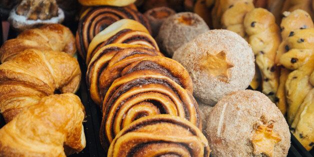 A variety of cakes and pastries on a boulangerie or patisserie market stall.