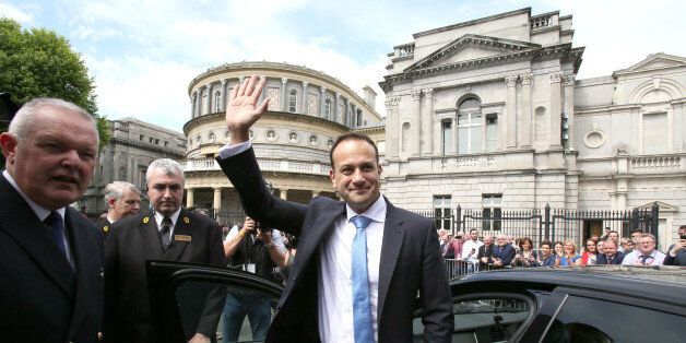 Leo Varadkar waves to colleagues as he leaves the parliament in Dublin after being confirmed as taoiseach on June 14, 2017. Leo Varadkar promised a 'republic of opportunity' Wednesday after he became Ireland's youngest prime minister and the first who is openly gay. The 38-year-old, who won the leadership of the ruling centre-right Fine Gael party earlier this month, was formally confirmed as taoiseach by parliament. / AFP PHOTO / Paul FAITH (Photo credit should read PAUL FAITH/AFP/Getty Images)
