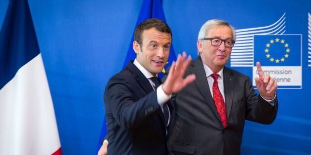 French President Emmanuel Macron (L) and European Commission President Jean-Claude Juncker pose during their meeting at the European Commission headquarters, on the sidelines of the NATO (North Atlantic Treaty Organization) summit, in Brussels, on May 25, 2017. / AFP PHOTO / Aurore Belot (Photo credit should read AURORE BELOT/AFP/Getty Images)
