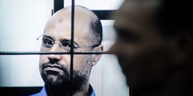 TRIPOLI, July 28, 2015 -- This file photo taken on April 27, 2014 shows Saif al-Islam Gaddafi on trial via video-conference software in a courtroom in Zintan, Libya. A Libyan court on Tuesday sentenced Saif al-Islam Gaddafi, son of the former leader Muammar Gaddafi, to death, according to local judicial resources. (Xinhua/Zhang Yuan via Getty Images)