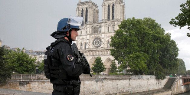 A French gendarme stands at the scene of a shooting incident near the Notre Dame Cathedral in Paris, France, June 6, 2017. REUTERS/Charles Platiau