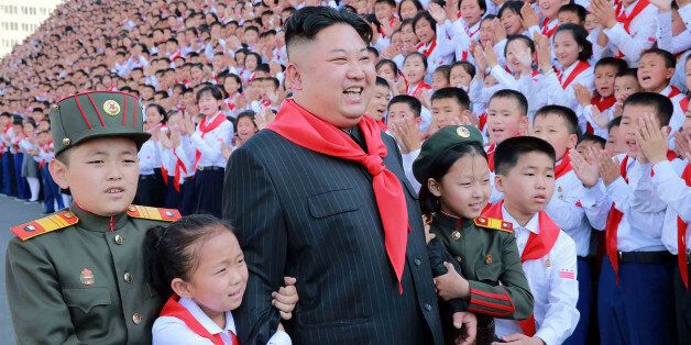 This picture taken on June 6, 2017 and released from North Korea's official Korean Central News Agency (KCNA) on June 9 shows North Korean leader Kim Jong-Un (C) at a photo session with the participants in the 8th Congress of the Korean Children's Union (KCU) in Pyongyang. / AFP PHOTO / KCNA VIA KNS / STR (Photo credit should read STR/AFP/Getty Images)