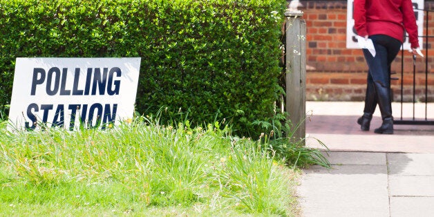 'Election Day in the UK and itaas time to vote at one of the nationwide Polling Stations, as depicted with a woman taking her polling card to cast her vote.'