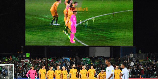 ADELAIDE, AUSTRALIA - JUNE 08: Socceroos players observe a minutes silence prior to the 2018 FIFA World Cup Qualifier match between the Australian Socceroos and Saudi Arabia at the Adelaide Oval on June 8, 2017 in Adelaide, Australia. (Photo by Daniel Kalisz/Getty Images)