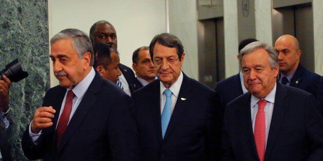UN Secretary-General Antonio Guterres (R) walks with Greek Cypriot leader Nicos Anastasiades (C) and Turkish Cypriot leader Mustafa Akinci (L) following a meeting on June 4, 2017 at UN headquarters in New York. / AFP PHOTO / Kena Betancur (Photo credit should read KENA BETANCUR/AFP/Getty Images)