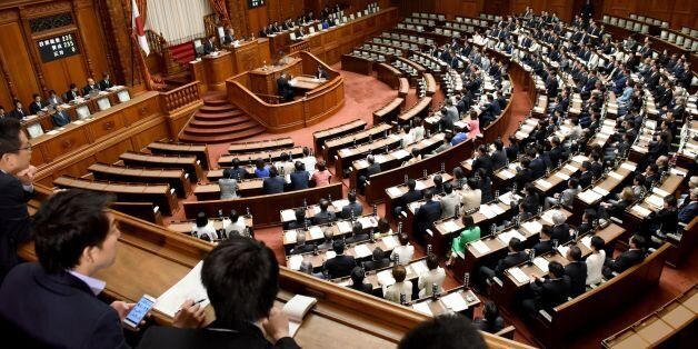 Members of Japan's upper house of parliament cast their ballots for a bill during the plenary session in Tokyo on June 9, 2017.Japan's parliament passed a law on June 9 that clears the way for its ageing Emperor Akihito to step down, in what would be the first imperial abdication in more than two centuries. / AFP PHOTO / Toru YAMANAKA (Photo credit should read TORU YAMANAKA/AFP/Getty Images)