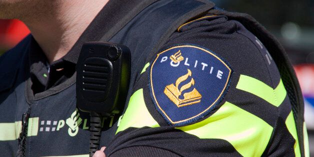 Amsterdam,netherlands-may 17, 2015: Dutch police badge and radio walkie talkie used for communications, police of Amsterdam