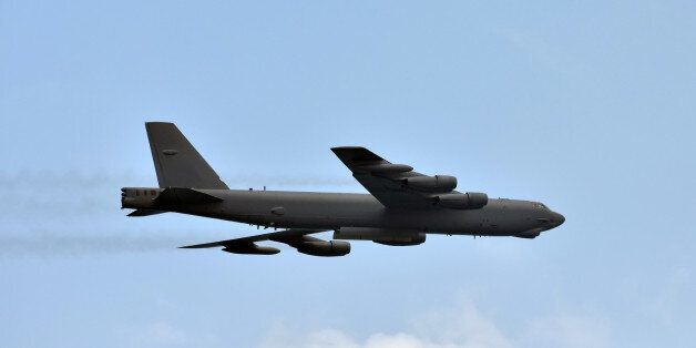Modern air force strategic bomber in flight side view
