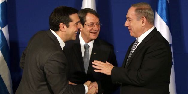Israeli Prime Minister Benjamin Netanyahu (R), Greek Prime Minister Alexis Tsipras (L) and Cypriot President Nicos Anastasiades (C) are seen during a trilateral meeting in Jerusalem to discuss eastern Mediterranean oil and gas on December 8, 2016. / AFP / GALI TIBBON (Photo credit should read GALI TIBBON/AFP/Getty Images)