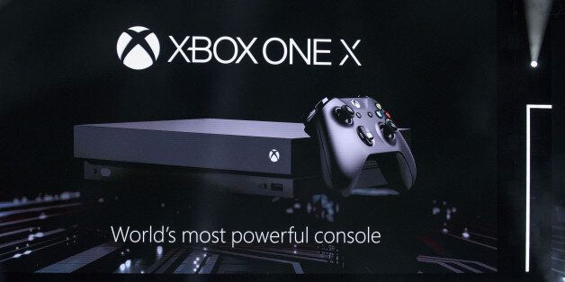 Microsoft Corp.'s Xbox One X video game console is revealed during the company's event ahead of the E3 Electronic Entertainment Expo in Los Angeles, California, U.S., on on Sunday, June 11, 2017. Microsoft announced a worldwide release date of Nov. 7 for what the company said will be its smallest and most powerful video-game console ever, the Xbox One X. Photographer: Patrick T. Fallon/Bloomberg via Getty Images