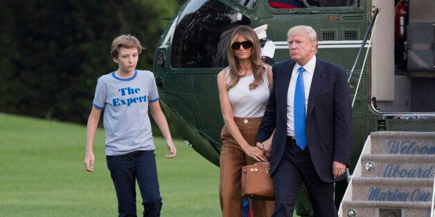 WASHINGTON, D.C. - JUNE 11: (AFP-OUT) U.S. President Donald Trump, first lady Melania Trump and their son Barron Trump arrive at the White House June 11, 2017 in Washington, DC. According to reports, Melania and Barron will soon be moving from Trump Tower in New York City to the White House. (Photo by Chris Kleponis-Pool/Getty Images)