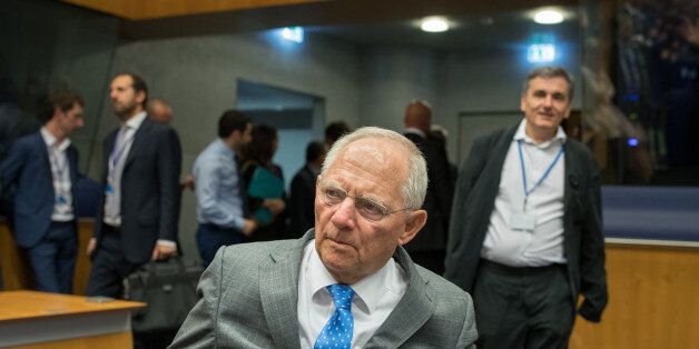 Wolfgang Schaeuble, Germany's finance minister, center, arrives ahead of Euclid Tsakalotos, Greece's finance minister, left, for a Eurogroup meeting of European finance ministers in Luxembourg on Thursday, June 15, 2017. Euro area finance ministers plan to disburse EU8.5b bailout tranche for Greece, two officials familiar with the matter say, asking not to be named, pending final decision. Photographer: Jasper Juinen/Bloomberg via Getty Images