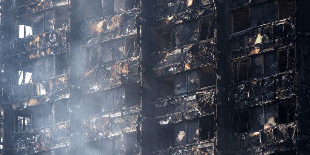 LONDON, UNITED KINGDOM - JUNE 15: The Grenfell residential tower block still smoulders following June 14th devastating fire in which 12 people so far are reported to have died, with dozens more injured and many reported missing on June 15, 2017 in London, England.PHOTOGRAPH BY Paul Davey / Barcroft ImagesLondon-T:+44 207 033 1031 E:hello@barcroftmedia.com -New York-T:+1 212 796 2458 E:hello@barcroftusa.com -New Delhi-T:+91 11 4053 2429 E:hello@barcroftindia.com www.barcroftimages.com (Photo cred