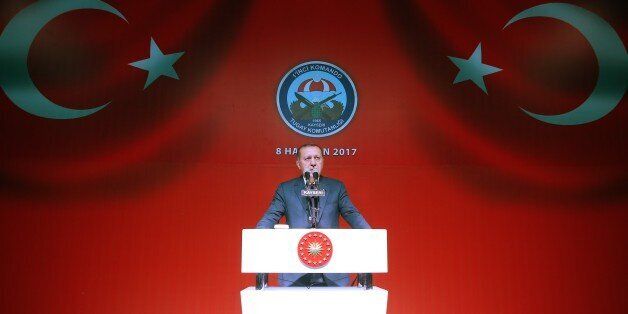 KAYSERI, TURKEY - JUNE 8: Turkish President Recep Tayyip Erdogan delivers a speech during his Iftar (fast breaking) dinner with families of Martyrs and soldiers at the 1st Commando Brigade in Kayseri, Turkey on June 8, 2017. (Photo by Kayhan Ozer/Anadolu Agency/Getty Images)