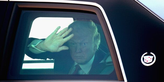 MILWAUKEE, WI - JUNE 13: U.S. President Donald Trump waves to guests as he leaves General Mitchell International Airport on June 13, 2017 in Milwaukee, Wisconsin. Trump made brief remarks about healthcare before departing the airport for a tour and roundtable discussion at Waukesha County Technical College. Trump is also scheduled to attend a fundraiser with Wisconsin Governor Scott Walker while in Milwaukee. (Photo by Scott Olson/Getty Images)