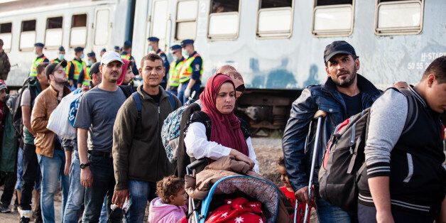 Zakany, Hungary - October 5, 2015: War refugees at Zakany Railway Station, Refugees are arriving constantly to Hungary on the way to Germany. 5 Octoberber 2015 in Zakany, Hungary.