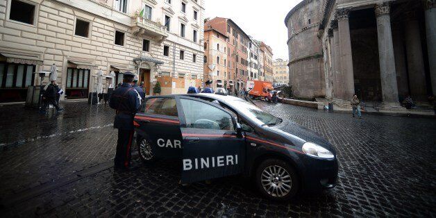 A Carabiniere military police car is parked in front of 'Ciuccula' bar, one of the around 20 restaurants and bars seized by police in Rome's historic center on January 22, 2014. Italian police swooped to arrest 90 people in a massive round up against the Contini clan of the Neapolitan Camorra Mafia believed to be heavily involved in laundering illicit earnings via apparently normal businesses and other investments, seizing 250 million euros worth of assets. AFP PHOTO / Filippo MONTEFORTE (Photo credit should read FILIPPO MONTEFORTE/AFP/Getty Images)
