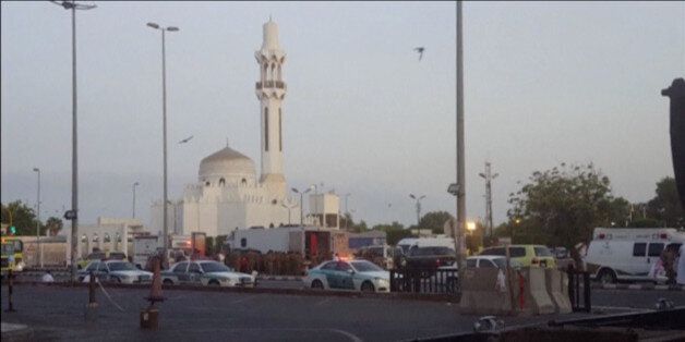 General view of security personnel in front of a mosque as police stage a second controlled explosion, after a suicide bomber was killed and two other people wounded in a blast near the U.S. consulate in Jeddah, Saudi Arabia, in this still frame taken from video July 4, 2016. REUTERS/REUTERS TV TPX IMAGES OF THE DAY
