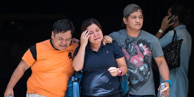 Relatives of a victim cry outside the Resorts World Hotel in Manila on June 2, 2017.A masked gunman set fire to a gaming room at a casino in the Philippine capital on June 1, igniting a toxic blaze that killed 36 people, authorities said, but they insisted it was not a terrorist attack. / AFP PHOTO / RODY (Photo credit should read RODY/AFP/Getty Images)