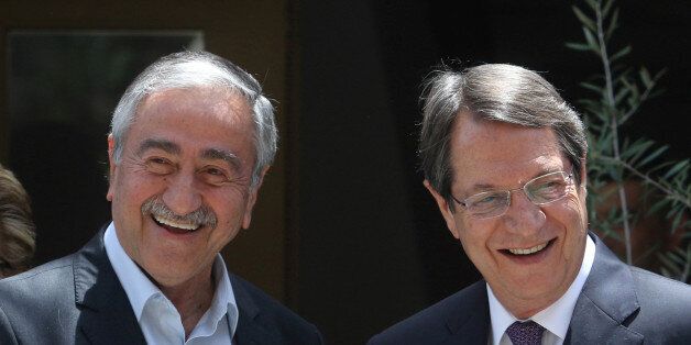 Greek Cypriot leader and Cyprus President Nicos Anastasiades (R) and Turkish Cypriot leader Mustafa Akinci smile during an event organized by the Bi-communal Technical Committee on Education in Nicosia, Cyprus June 2, 2016. REUTERS/Yiannis Kourtoglou