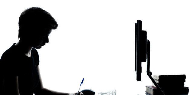 one young teenager silhouette boy or girl studying with computer computing laptop in studio cut out isolated on white background