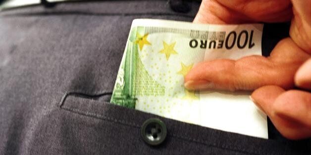 (AUSTRALIA & NEW ZEALAND OUT) 100 euro being taken out from the back pocket of trousers, 1 September 2002. AFR Picture by ERIN JONASSON (Photo by Fairfax Media via Getty Images)