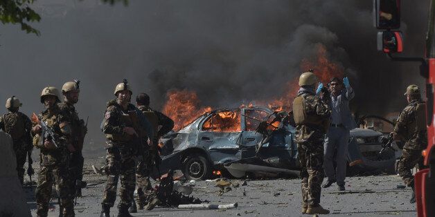 Afghan security forces personnel are seen at the site of a car bomb attack in Kabul on May 31, 2017.At least 40 people were killed or wounded on May 31 as a massive blast ripped through Kabul's diplomatic quarter, shattering the morning rush hour and bringing carnage to the streets of the Afghan capital. / AFP PHOTO / SHAH MARAI (Photo credit should read SHAH MARAI/AFP/Getty Images)
