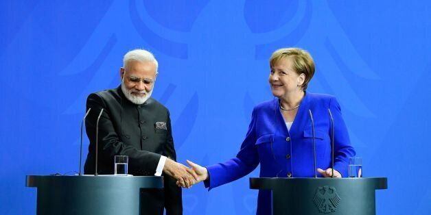 German Chancellor Angela Merkel shakes hands with Indian Prime Minister Narendra Modi during a press conference following talks and the signing of agrreements at the Chancellery in Berlin, on May 30, 2017. Germany is India's largest trading partner in the EU, and a top source of foreign direct investment. / AFP PHOTO / Tobias SCHWARZ (Photo credit should read TOBIAS SCHWARZ/AFP/Getty Images)