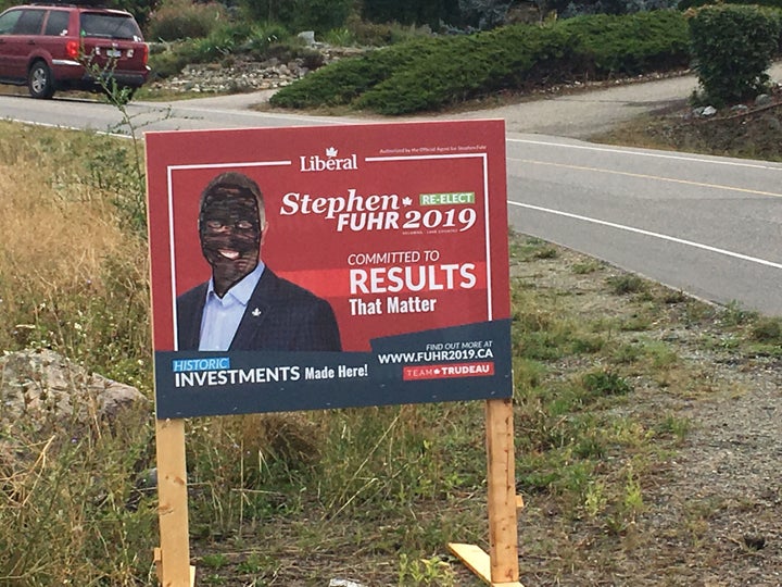 Photo of a defaced election sign for Kelowna—Lake Country Liberal candidate Stephen Fuhr.