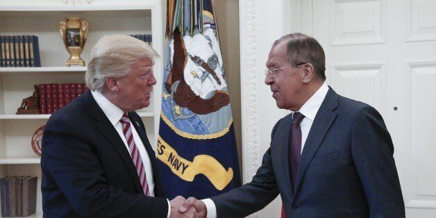WASHINGTON, USA - MAY 10: US President Donald Trump (R) and Russia's Foreign Minister Sergei Lavrov (L) shake hands as they meet at the Oval Office of White House in Washington, D.C., United States on May 10, 2017. (Photo by Russia Foreign Minister Press Ofice /Anadolu Agency/Getty Images)