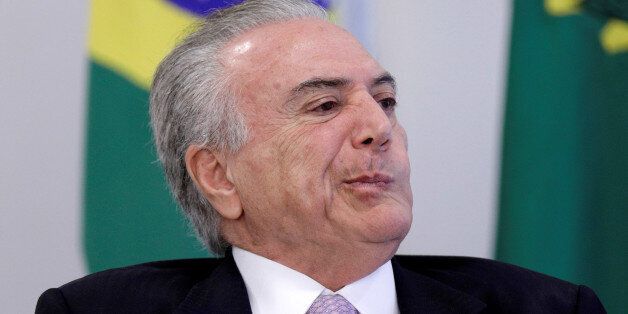 Brazil's President Michel Temer reacts during a signing ceremony of the New Decree of Port Regularization, at the Planalto Palace in Brasilia, Brazil May 10, 2017. REUTERS/Ueslei Marcelino