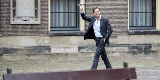 Dutch Prime Minister Mark Rutte waves as he arrives at the Binnenhof for a meeting with Edith Schippers, in The Hague, the Netherlands, on May 18, 2017. Schippers has been re-appointed 'informateur' by the Lower House of parliament after differences over immigration scuppered attempts to form a four-party coalition government. / AFP PHOTO / ANP / Jerry Lampen / Netherlands OUT (Photo credit should read JERRY LAMPEN/AFP/Getty Images)