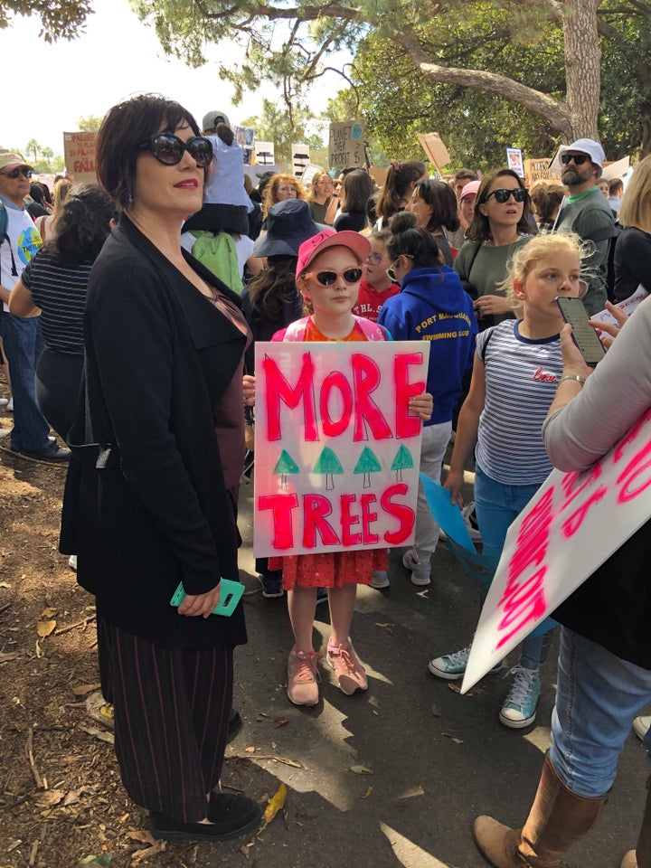 School children shout slogans as they march in a strike and protest by students highlighting inadequate progress to address climate change. 