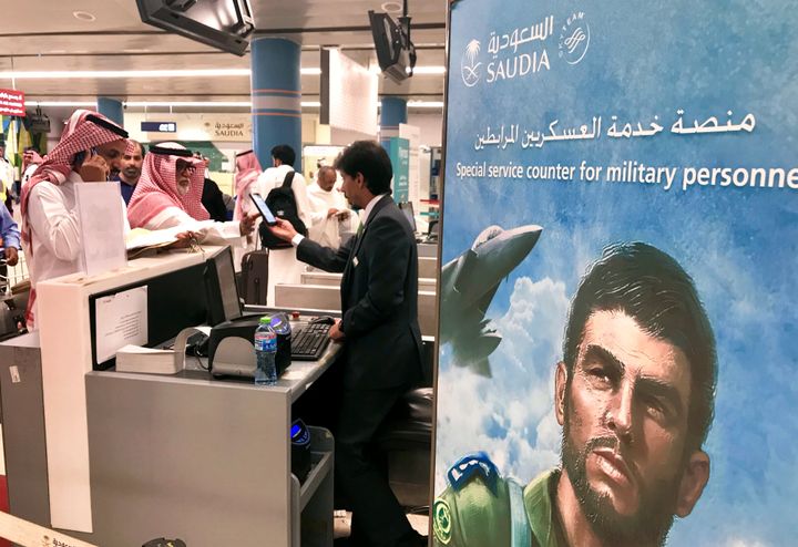 Passengers talk to an airline employee at Saudi Arabia's Abha airport, after it was attacked by Yemen's Houthi group, in Abha, Saudi Arabia June 24, 2019. REUTERS/Nael Shyoukhi