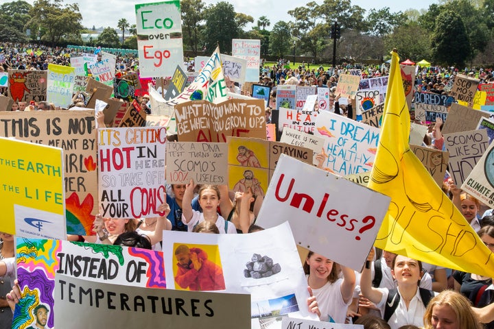 Thousands gathered in Sydney, many bearing signs decrying the government's support of fossil fuel and inaction on climate change. (Photo by Jenny Evans/Getty Images)