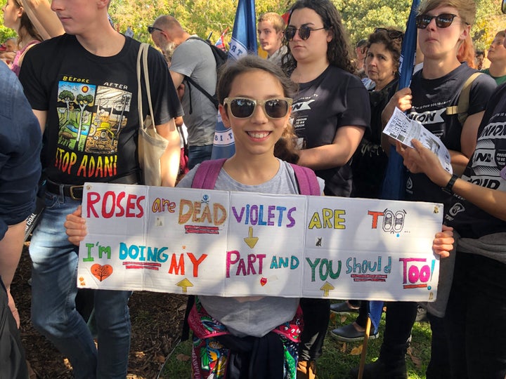 Rebecca Manuguerra, 10, holds up a sign she made for Friday's climate strike in Sydney.