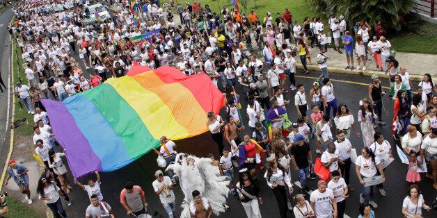Participants carry a rainbow flag during the Gay Pride Parade in Panama City, Panama, July 1, 2017. REUTERS/Carlos Lemos