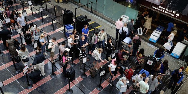ARLINGTON, VA - MAY 27: Passengers queue up outside a Transportation Security Administration checkpoint at Ronald Reagan National Airport May 27, 2016 in Arlington, VA. According to AAA, 'more than 38 million Americans will travel this Memorial Day weekend. That is the second-highest Memorial Day travel volume on record and the most since 2005. Spurred by the lowest gas prices in more than a decade, about 700,000 more people will travel compared to last year.' (Photo by Chip Somodevilla/Getty