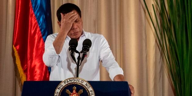 Philippine President Rodrigo Duterte gestures as he gives a speech during the mass oath taking of officials of various national leagues at the Malacanang Palace in Manila on June 1, 2017.Philippine airstrikes aimed at Islamist militants who are holding hostages as human shields in a southern city killed 11 soldiers, authorities said on June 1, as they conceded hundreds of gunmen may have escaped a blockade. / AFP PHOTO / NOEL CELIS (Photo credit should read NOEL CELIS/AFP/Getty Images)