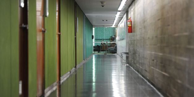 Picture of the empty corridor leading to the Lower House in Brasilia taken on May 18, 2017 a day after it was reported by a local newspaper that Brazilian President Michel Temer had been secretly recorded agreeing to payments of hush money to a jailed politician.Temer reeled Thursday from a report that he authorized payment of hush money to Eduardo Cunha, the disgraced former speaker of the lower house of Congress, in a scandal threatening to plunge Latin America's biggest country into political