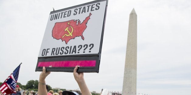 Demonstrators take part in the March for Truth rally on the National Mall in Washington, DC, on June 3, 2017.Sharp political passions over US President Donald Trump's withdrawal from the Paris climate treaty and his alleged links to Russia brought people onto the streets of cities around the globe on Saturday. / AFP PHOTO / SAUL LOEB (Photo credit should read SAUL LOEB/AFP/Getty Images)