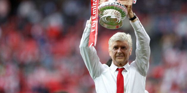 Britain Soccer Football - Arsenal v Chelsea - FA Cup Final - Wembley Stadium - 27/5/17 Arsenal manager Arsene Wenger celebrates with the trophy after winning the FA Cup finalAction Images via Reuters / Lee Smith EDITORIAL USE ONLY. No use with unauthorized audio, video, data, fixture lists, club/league logos or