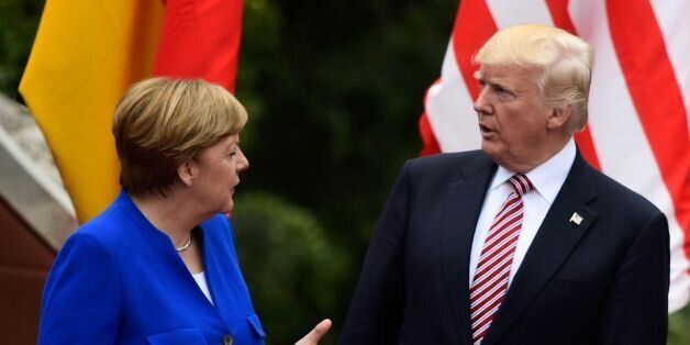 German Chancellor Angela Merkel talks with US President Donald Trump as they attend the Summit of the Heads of State and of Government of the G7, the group of most industrialized economies, plus the European Union, on May 26, 2017 at the ancient Greek Theater in Taormina, Sicily.The leaders of Britain, Canada, France, Germany, Japan, the US and Italy will be joined by representatives of the European Union and the International Monetary Fund (IMF) as well as teams from Ethiopia, Kenya, Niger, Nigeria and Tunisia during the summit from May 26 to 27, 2017. / AFP PHOTO / Miguel MEDINA (Photo credit should read MIGUEL MEDINA/AFP/Getty Images)