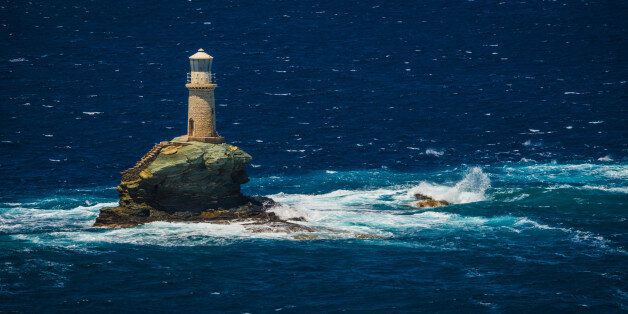 Scenic view to lighthouse near the city of Andros, Andros, Greece