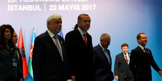 Turkish President Tayyip Erdogan and his Greek counterpart Prokopis Pavlopoulos leave following a group photo session during the 25th anniversary summit of the Organisation of the Black Sea Economic Cooperation (BSEC) in Istanbul, Turkey, May 22, 2017. REUTERS/Murad Sezer