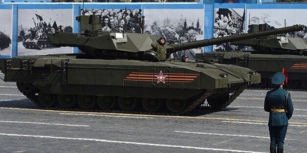 MOSCOW, RUSSIA - MAY 9: Russian T 14 Armata tanks making their way during the Victory Day international military parade to mark the 70th anniversary of the 1945 victory over Nazi Germany and the end of World War II on May 9, 2015 in Moscow, Russia. A Russian T 14 Armata tank, Russian Kurganets-25 infantry fighting vehicles, self-propelled artillery system 'Koalitsija SV', 'Yars' land-based mobile missile system and BTR-82A armoured personnel carrier participated in the parade. (Photo by Dmitry Dukhanin/Kommersant Photo via Getty Images)