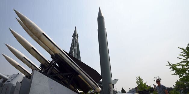 A man walks past replicas of a North Korean Scud-B missile (C) and South Korean Hawk surface-to-air missiles (L) at the Korean War Memorial in Seoul on May 29, 2017.North Korea on May 29 test-fired a ballistic missile, the latest in a series of launches that have ratcheted up tensions over its quest to develop weapons capable of hitting the United States. / AFP PHOTO / JUNG Yeon-Je (Photo credit should read JUNG YEON-JE/AFP/Getty Images)