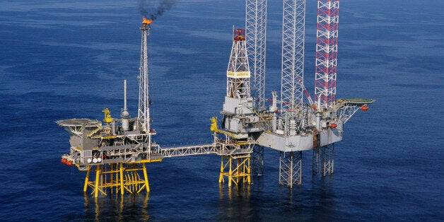 A Santa Fe Galaxy II platform drills a development well at the Thebaud Field natural gas production platform #1-84 in the Sable Island area of the North Atlantic. The Thebaud field is approximately 300 kilometers southeast of Halifax, Nova Scotia. The production platform is owned by Sable Offshore Operators Consortium, and the jack-up drilling platform (r) is owned by GlobalSantaFe Corporation.