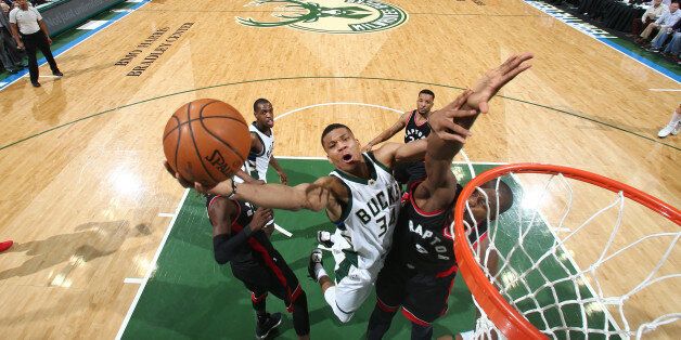 Milwaukee, WI - APRIL 27: Giannis Antetokounmpo #34 of the Milwaukee Bucks goes up for a shot against the Toronto Raptors during Game Six of the Eastern Conference Quarterfinals of the 2017 NBA Playoffs on April 27, 2017 at the BMO Harris Bradley Center in Milwaukee, Wisconsin. NOTE TO USER: User expressly acknowledges and agrees that, by downloading and/or using this photograph, user is consenting to the terms and conditions of the Getty Images License Agreement. Mandatory Copyright Notice: Copyright 2017 NBAE (Photo by Nathaniel S. Butler/NBAE via Getty Images)